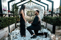 Romantic glasshouse proposal for Sanjesh and Niyanta featuring a white petal heart floral arrangement, photographed by Auckland proposal photographer Zanthe Vorsatz.