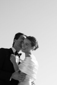 Bride and groom leaning in for a kiss