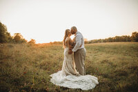 A bride & groom at sunset at Barn on Unity Farm in West Virginia, captured by Melena Lawson, a Blacksburg, Virginia Photographer.