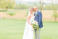 Couple smiles on their wedding day photographed by Baltimore Wedding Photographer, Cait Kramer