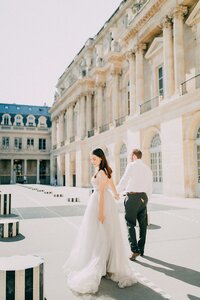 Bride and groom walk up memorial steps at their DC wedding