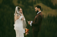 groom holding bride in arms, wedding photographer in colorado