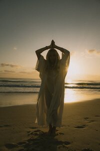 HarJiwan posing with hands together at sunset