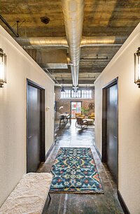 Entrance into this 4-bedroom, 2-bathroom vacation rental condo in the historic Behrens building in downtown Waco, TX