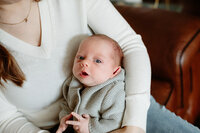portrait of an infant in the arms of his mother