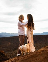 rock climbing to the top of a cliff edge to say vows during elopement