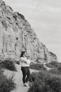 portrait of Southern California wedding photographer standing in front of the mountains
