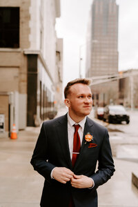 A groom smiles during his portraits in downtown Chicago.