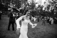 bride running up to hug a friend 