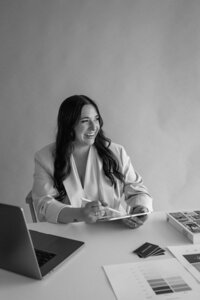 Brand and Showit website designer in Fort Wayne, IN sitting in a chair