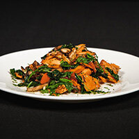 Smoked sockeye salmon on black kale, sauteed criminis, roma tomato, arugula, white wind garlic dressing from Max Dales Steak and Chop House Restaurant