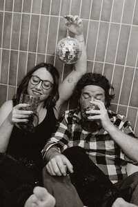 Couple partying in a bathtub with champagne and a disco ball in Breckenridge, Colorado.