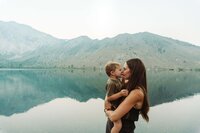 family throwing baby in the air in mammoth lakes