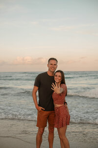 shot of photographer and fiance getting engaged