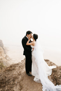 Bride and groom eloping on the California coast. Big Sur elopement at sunrise. 