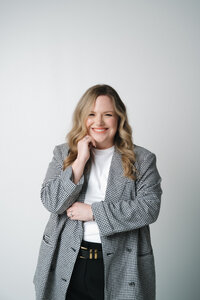 Jenny, lead wedding planner at Blush Events in Wichita, Kansas, smiling in professional portrait.
