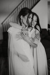 Black and white bride and maid of honor photograph