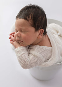 Image of sleeping baby in a posed studio newborn photography session by Lauren Vanier, Newborn Photographer