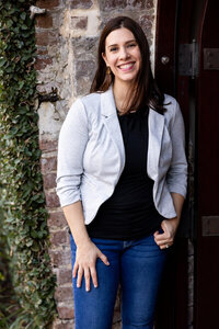 Photographer Myra Kushon outside in a gray blazer