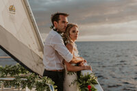 couple kissing on the beach in Maui bride and groom