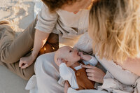 Photo of a couple holding a baby