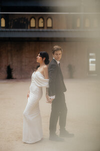 The Abbey On Monroe Wedding Photographer and Videographer Bride and Groom Standing Back to Back