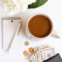 Desk with money and note pad