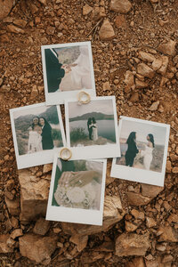 Polaroids laid out on rocks on a path 