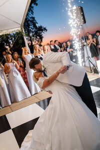 A blurry photo of a bride and her shoes