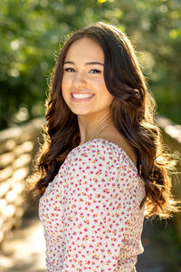Custom senior portrait session for a high school student in Ann Arbor, featuring personal styling and beautiful outdoor scenery.
