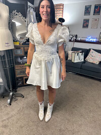 Shortened vintage wedding dress paired with cowboy boots