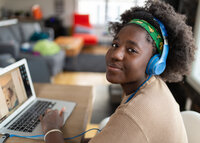 girl smiling on the computer