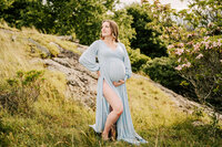 Pregnant woman in blue flowing dress at a Maternity session in Clearwater, FL