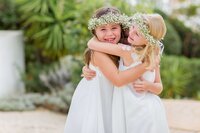 flower girls hugging