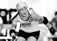 Web Designer Jo Pate playing roller derby