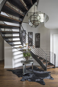 Modern Round Staircase with Wooden Flooring