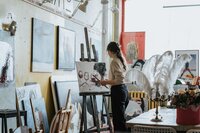 woman painting in a studio