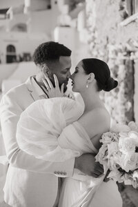 black and white image bride and groom embracing