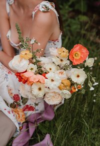 bride holding flowers