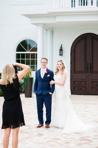 photographer shooting bride and groom