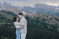 Denver Engagement Photographer, Couple smiles at each other during Loveland Pass engagement photos.