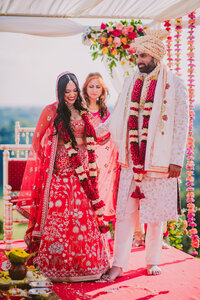 Indian bride and groom during performing their hindu ceremony at the natirar mansion in nj