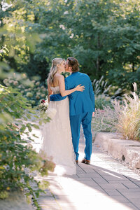 Bride and Groom Kissing in a garden at Ivy Ridge Wedding Venue.