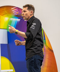 Live event photo capturing a keynote speaker at a  networking event in Birmingham