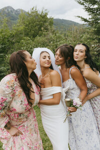 bride maids snuggle in together captured by bc wedding photographer