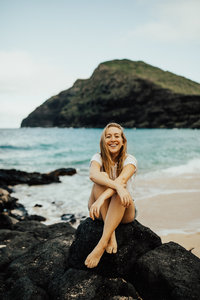 girl smiling by ocean