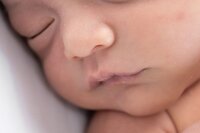 Edmonds Newborn Photographer captures details of little lips and nose during a newborn photography session in Edmonds, WA