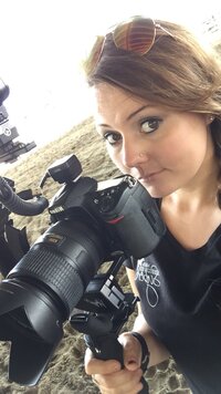 Hiliary photographed with camera during a horse show