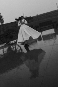 Wedding couple dancing in the rain