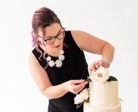 woman packaging sugar flowers